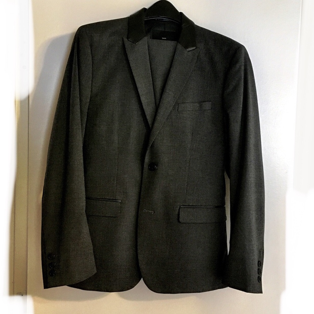 Slim fit charcoal blazer.